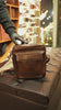 buy mens travel shoulder bag in leather
